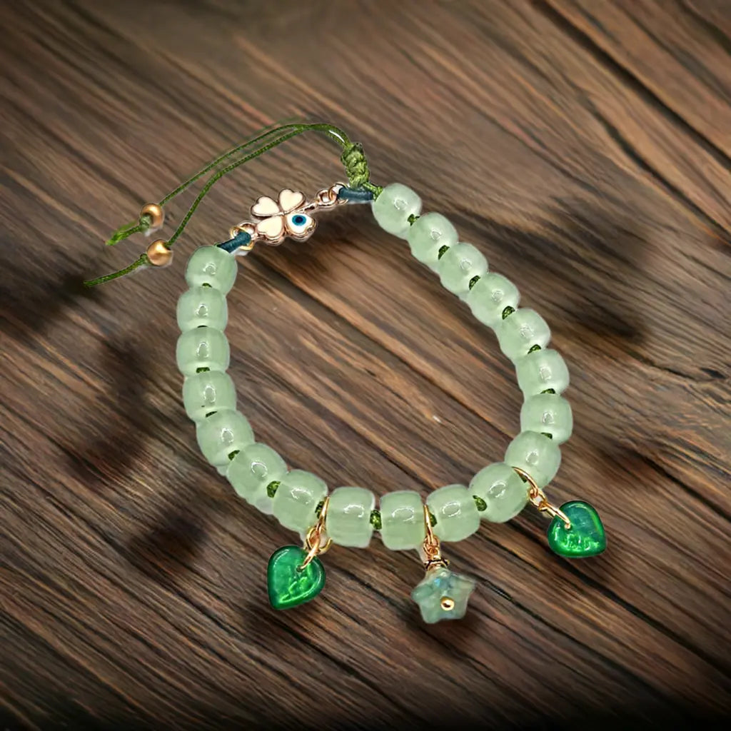 Green adjustable beaded Bracelet Evil eyes 4 leaves