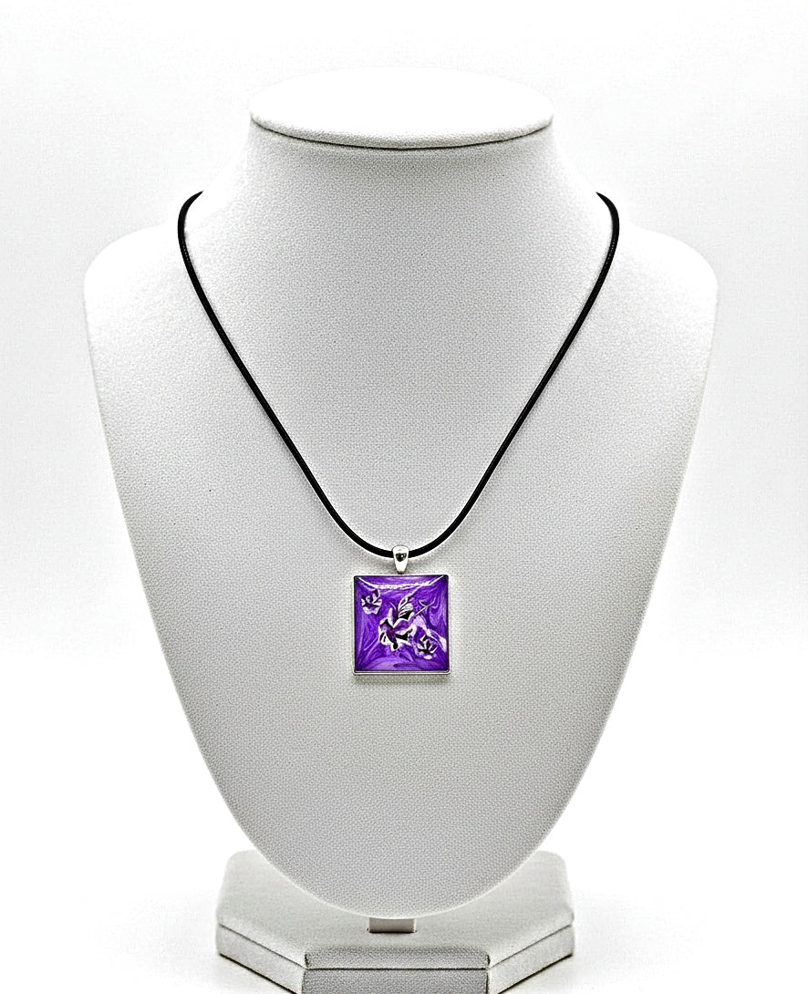 Necklace with a purple pendant on a white bust