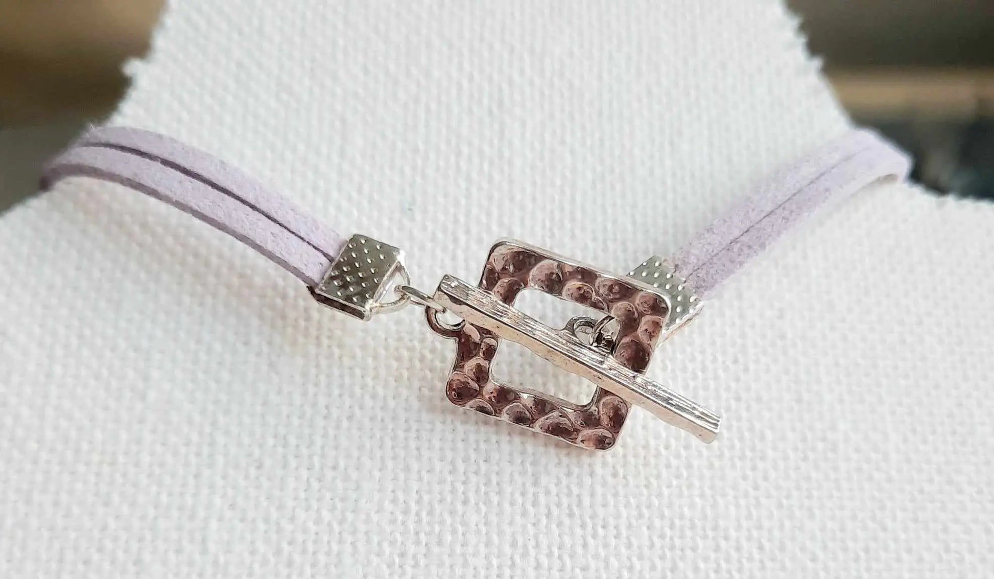 Light purple faux suede rainbow heart bracelet