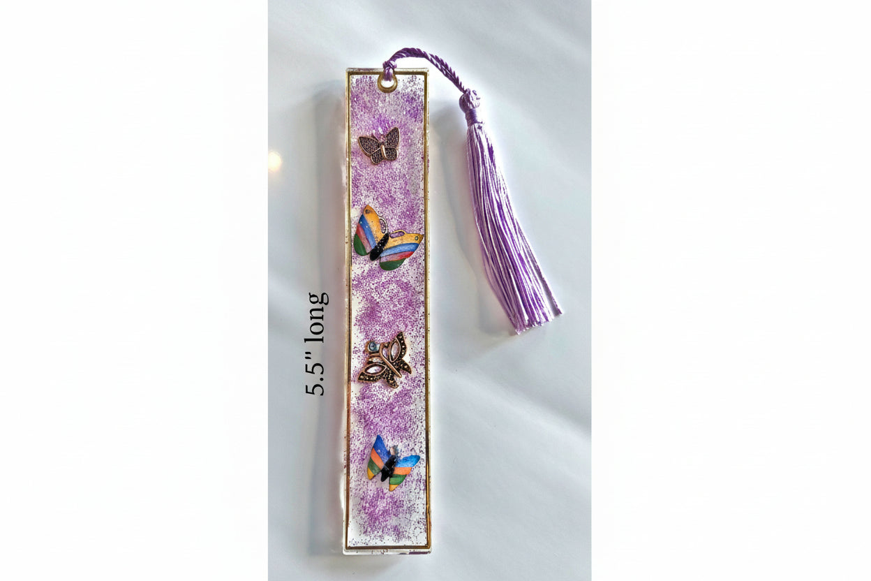 Decorative bookmark with butterflies and a tassel on a white background