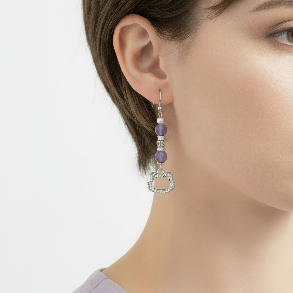 Earring worn by a person on a plain background