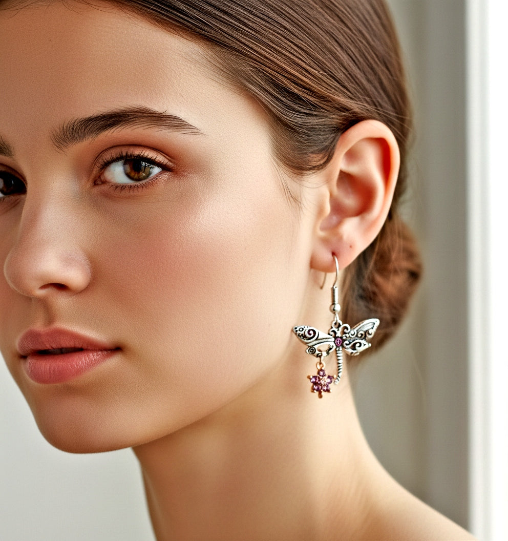 Close-up of a woman wearing a decorative earring with a neutral background