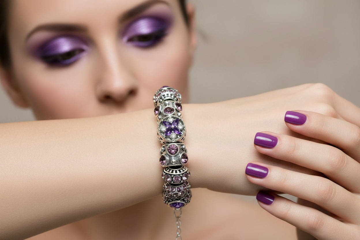 Silver bracelet with purple and pink beads on a wooden branch