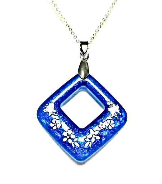 Blue Resin white flower necklace by Josie