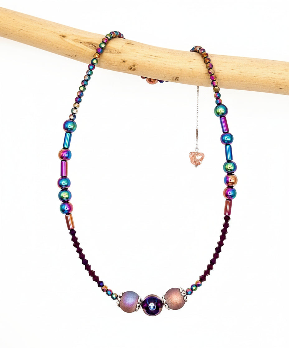Colorful beaded necklace on a white background with JVDJewelry.com branding.