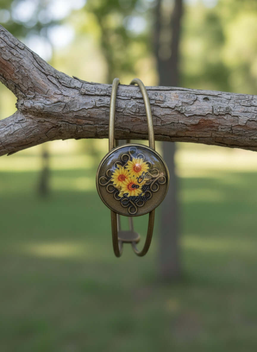 antique bronze adjustable bracelet featuring a colorful resin flower design on a tree branch
