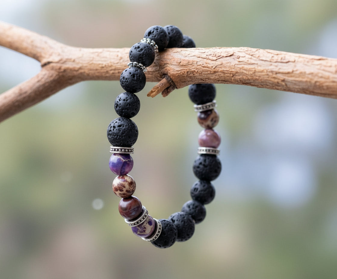 Bracelet with dark beads and purple accents on a white background