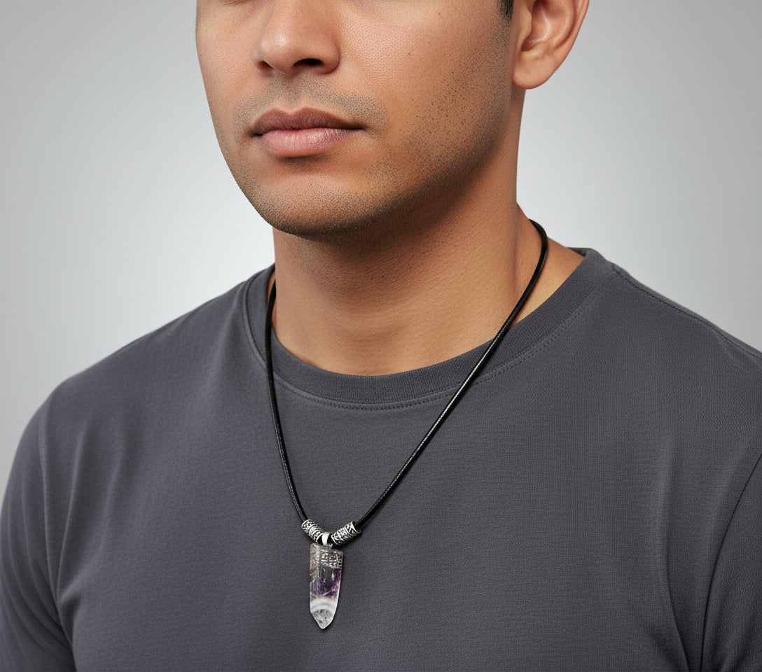 Necklace with a crystal pendant on a dark wooden surface