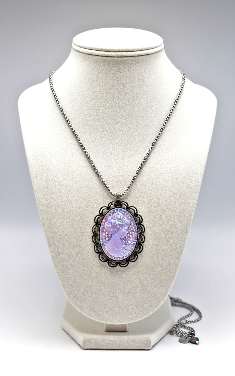 Necklace with a purple cameo pendant on a white mannequin bust.