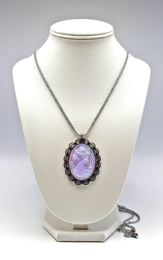Necklace with a purple cameo pendant on a white mannequin bust.