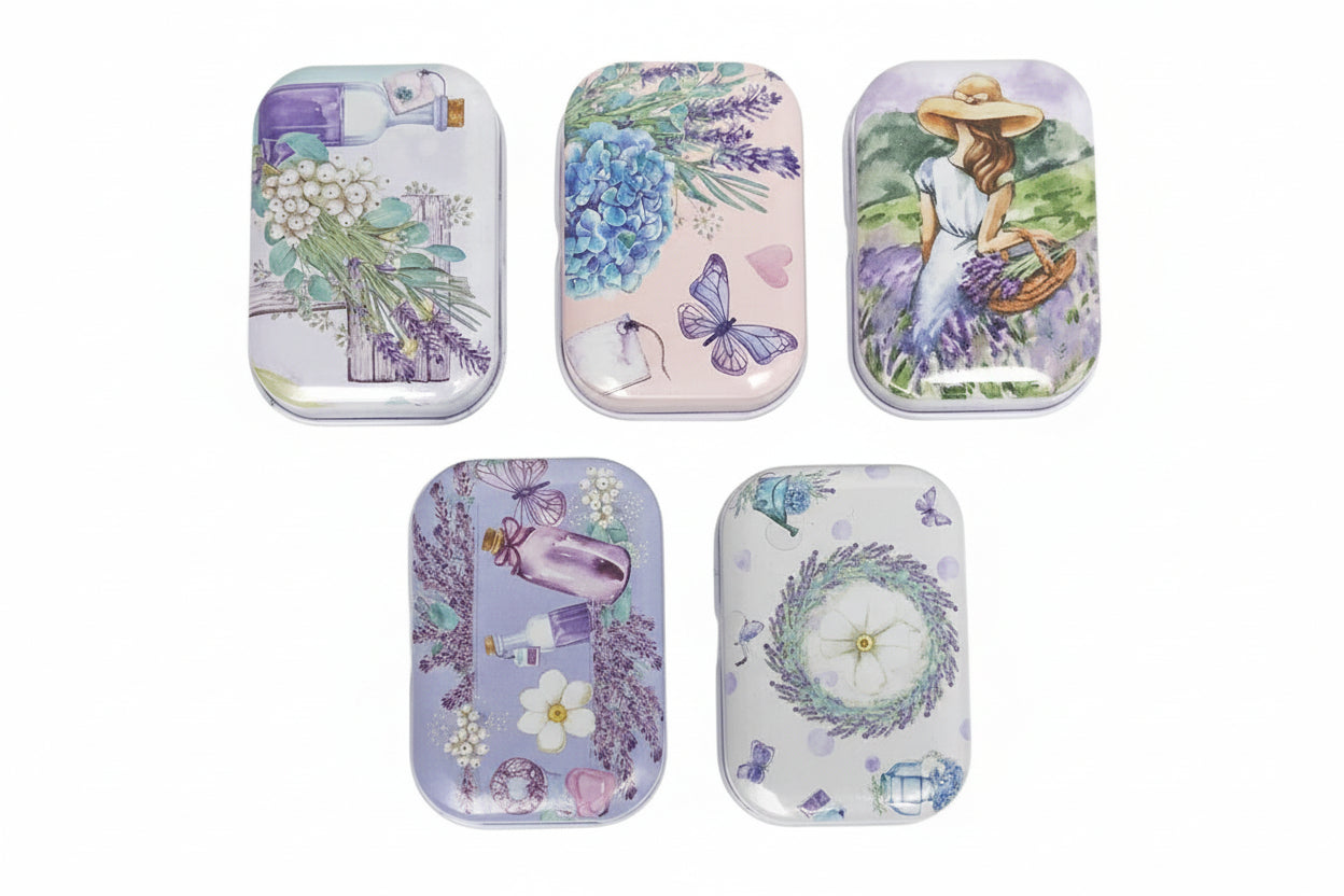 Set of five decorative tins with floral and nature-themed designs on a white background.