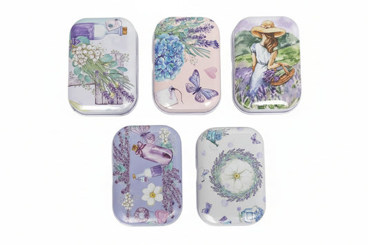 Set of five decorative tins with floral and nature-themed designs on a white background.