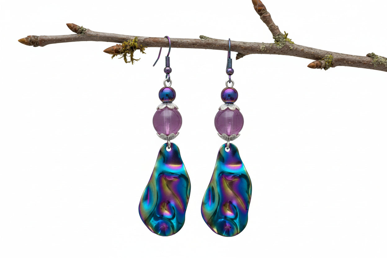 Multicolored teardrop earrings with purple beads on a white background