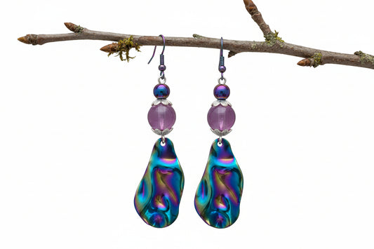 Multicolored teardrop earrings with purple beads on a white background
