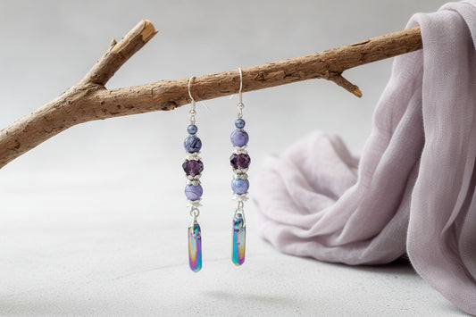 Two beaded hair clips with colorful beads on a light gray background