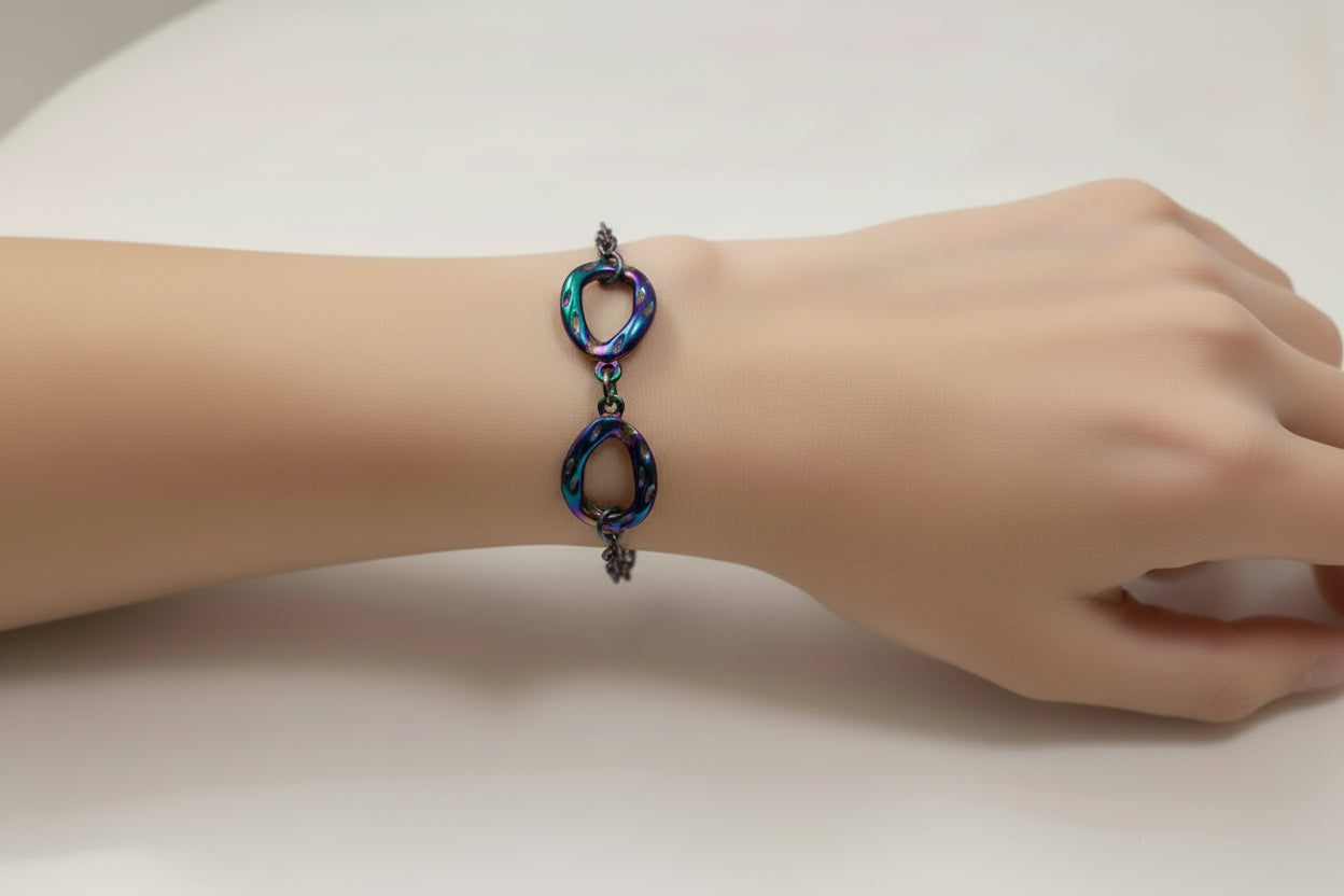 Multicolored chain bracelet on a light gray background