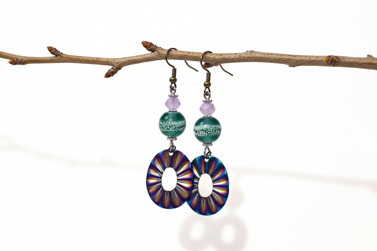 Colorful circular earrings with beaded accents on a white background