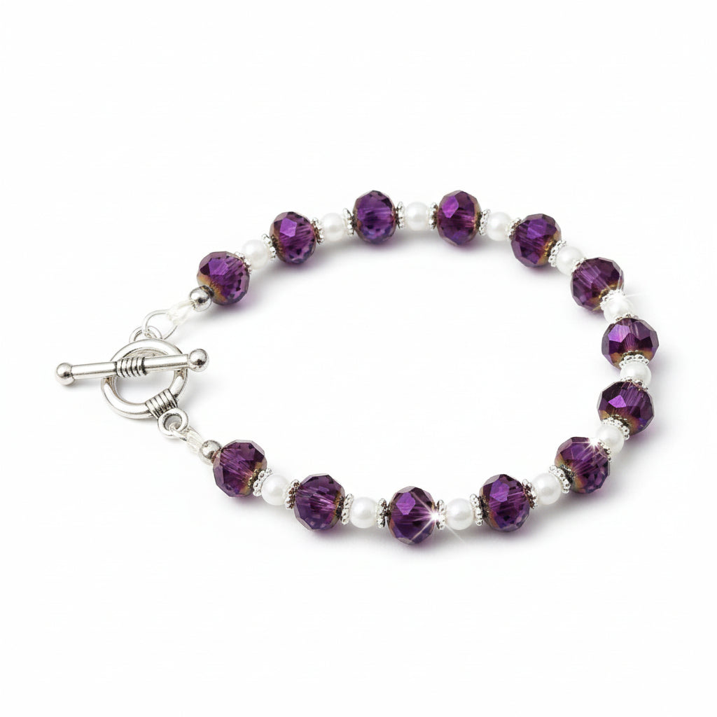 Beaded bracelet with purple and white beads on a gray background