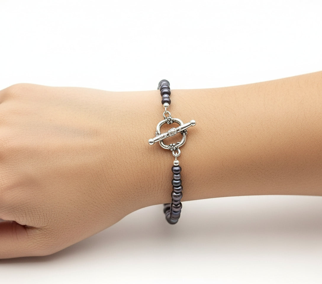 Beaded bracelet on a branch with 'JVDJEWELRY.COM' branding