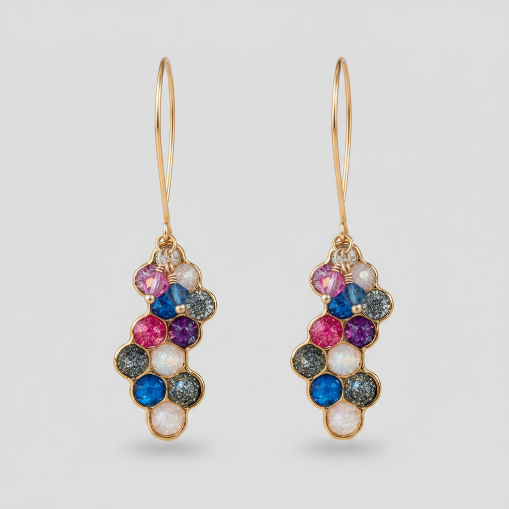 A split image showing a pair of gold hoop drop earrings with a cluster of colorful gemstones. The left side shows the earrings worn on a person's ear, and the right side shows a close-up of the earrings hanging from a tree branch with a blurred garden background.
