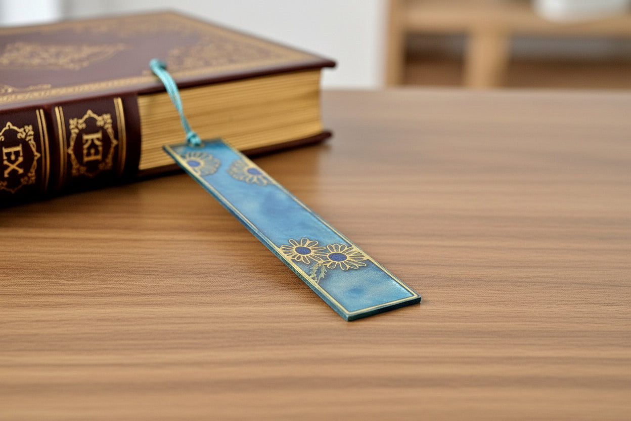 Decorative book with a blue bookmark and tassel on a white background