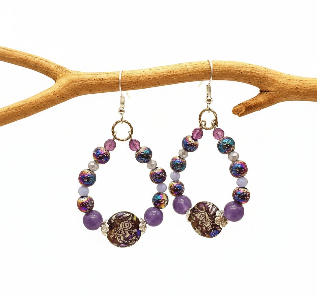 Beaded earrings with colorful beads and gold accents on a yellow background